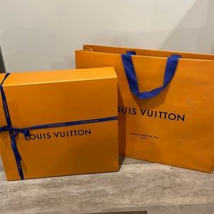 Large magnetic Louis Vuitton box with ribbon and bag.